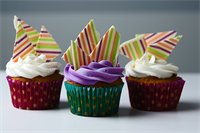 Couture Cupcakes 1 : Available in many Flavors, Colors & Seasonal Themes (Yes the striped pieces on top are edible.  They're chocolate!)